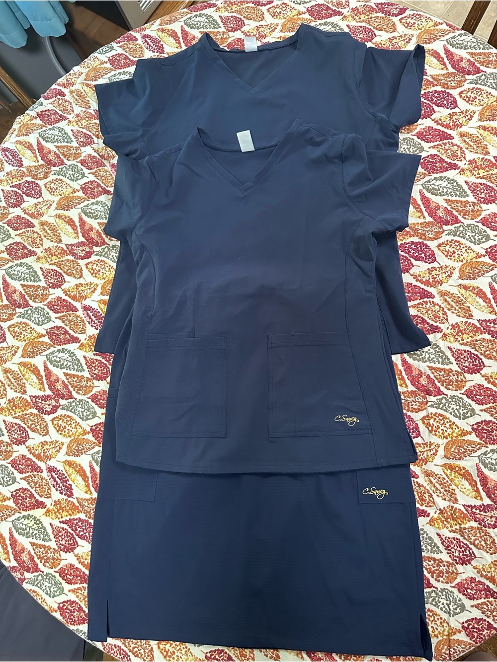 Navy scrub set. M and L top, L skirt.